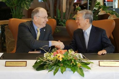 Johnson Controls CEO Alex Molinaroli and Hitachi CEO Hiroaki Nakanishi entered into a joint venture definitive agreement at the World Economic Forum in Davos, Switzerland, on Jan. 21, 2015. Johnson Controls CEO Alex Molinaroli and Hitachi CEO Hiroaki Nakanishi entered into a joint venture definitive agreement at the World Economic Forum in Davos, Switzerland, on Jan. 21, 2015.